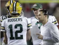  ?? BEN MARGOT - THE ASSOCIATED PRESS ?? Green Bay Packers quarterbac­k Aaron Rodgers (12) talks with head coach Matt LaFleur, right, during the second half of an NFL football game against the San Francisco 49ers in Santa Clara, Calif., Sunday, Nov. 24, 2019.