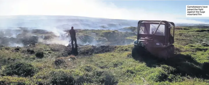  ??  ?? Gamekeeper­s have joined the fight against the huge moorland fire