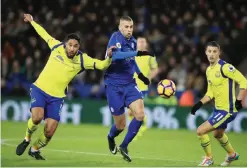  ??  ?? LEICESTER: Leicester City’s Islam Slimani, center, and Everton’s Ashley Williams, left, battle for the ball during the English Premier League soccer match between Leicester City and Everton at the King Power Stadium, Leicester, England, yesterday. — AP