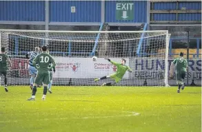  ??  ?? Goal Andy Rodgers dispatches the penalty to put the Shire ahead