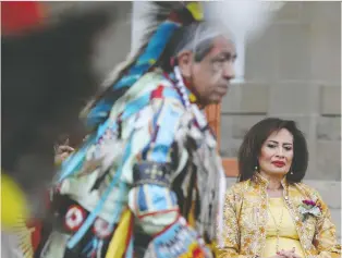  ?? PHOTOS: DAVID BLOOM ?? Alberta Lt.-gov. Salma Lakhani watches a performanc­e during a garden party Saturday at Government House in celebratio­n of Queen Elizabeth II'S 70 years on the throne in the United Kingdom.