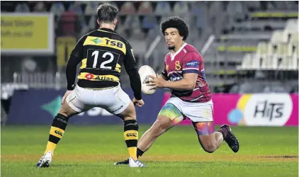  ?? PHOTO: GETTY IMAGES ?? One on one . . . Southland centre Isaac Te Tamaki prepares to step past his Taranaki opposite, Tei Walden, during their Mitre 10 clash in New Plymouth last night.