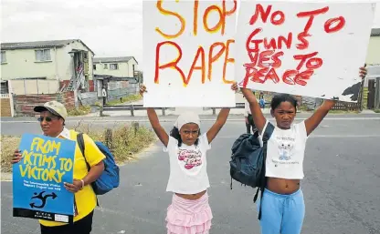  ?? /Esa Alexander ?? Vulnerable and at risk: Parents and children in Hanover Park, Cape Town, take to the streets to protest against violence and the abuse of women and children in their community.