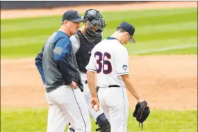  ?? UConn Athletics ?? Milford’s Josh MacDonald, left, pays a mound visit to a UConn hurler. MacDonald is in his eighth season as the Huskies’ pitching coach.