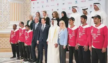  ??  ?? ■ Shaikh Mohammad and Sebastian Kurz, Chancellor of Austria, and Dr Rainer Seele pose for a picture with others during a reception held at the Presidenti­al Palace. WAM