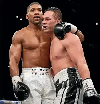  ?? PHOTO: PHOTOSPORT ?? Anthony Joshua, left, shows due respect to Joseph Parker at the end of their fight.