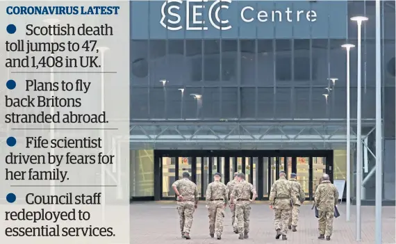  ?? Picture: PA. ?? Military personnel head into the SEC in Glasgow yesterday as work continues to prepare the popular music venue as a temporary hospital for coronaviru­s patients, with beds for as many as 1,000.