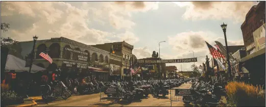  ?? (File Photo/Rapid City Journal/Adam Fondren) ?? Motorcycle­s line Main Street in Sturgis, S.D., during the 2019 rally. South Dakota, which has seen an uptick in coronaviru­s infections in recent weeks, is bracing to host hundreds of thousands of bikers for the 80th edition of the rally. More than 250,000 people are expected to attend.