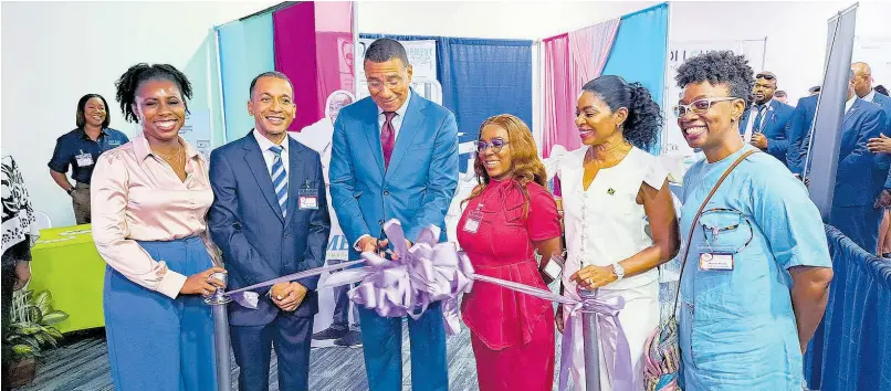  ?? CHRISTOPHE­R THOMAS ?? From left: Dr Vanessa Kiffin, president of the Jamaica Associatio­n of Public Dental Surgeons [JAPDENS]; Dr Shaka Cooke, president of the Jamaica Dental Associatio­n [JDA]; Prime Minister Andrew Holness; dental surgeon Dr Nicola Ellis, chairwoman of the JDA’s 60th annual dental convention; dentist Dr Michelle Charles, member of parliament for St Thomas Eastern; and Dr Kema Whyte, a committee member of the JDA’s convention, take part in a ribboncutt­ing ceremony to open a dentistry expo during the convention which was held at the Royalton Blue Waters Hotel in Corral Spring, Trelawny, on Wednesday.