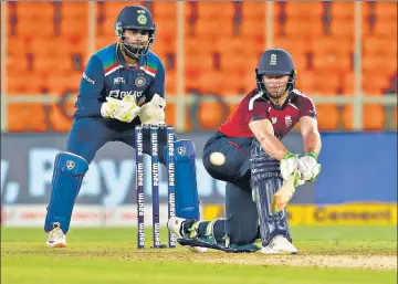  ??  ?? Jos Buttler hits a reverse sweep during his unbeaten 83 off 52 balls which helped England beat India in the third T20I on Tuesday.