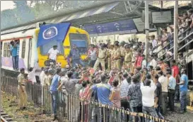  ?? PTI ?? Dalit protestors stop a train during a Rail Roko protest at Dadar station in Mumbai on Wednesday over Monday’s Bhima Koregaon violence.