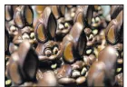  ?? The Associated Press file ?? Chocolate rabbits wait to be decorated at the Cocoatree chocolate shop in Lonzee, Belgium. The price of cocoa has climbed to record highs.