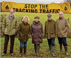  ??  ?? Not in our village: Lord Cowdray, left, with fracking protesters in 2013