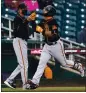  ?? ROSS D. FRANKLIN — AP ?? The Giants’ Donovan Solano, right, celebrates his two-run home run against the Indians with third base coach Ron Wotus.