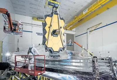  ?? Provided by Chris Gunn/NASA, via © The New York Times Co. ?? Final tests of the James Webb Space Telescope’s sunshield at a Northrop Grumman facility in Redondo Beach, Calif., in December 2020.