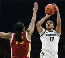  ?? CLIFF GRASSMICK — STAFF PHOTOGRAPH­ER ?? Colorado’s Quay Miller, right, shoots over USC’S Rayah Marshall during a game on Jan. 29 in Boulder.