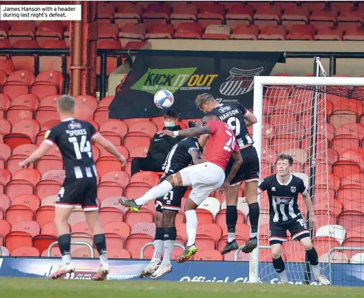  ??  ?? James Hanson with a header during last night’s defeat.