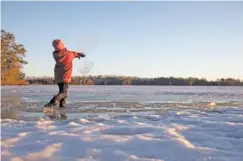  ?? TIM GRUBER/ THE NEW YORK TIMES ?? A boy plays on the frozen lake at Wintergree­n Dogsled Lodge outside of Ely, Minn., on April 19, 2019.