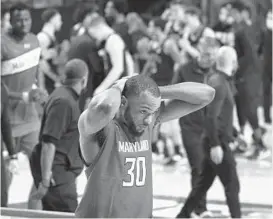  ??  ?? Maryland senior Galin Smith walks off the court in frustratio­n after a loss to Penn State on Sunday night at Xfinity Center. KENNETH K. LAM/BALTIMORE SUN