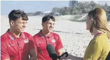  ??  ?? The McCormack brothers get interviewe­d on the beach.