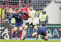  ??  ?? Clinical Artem Dzyuba of Russia piled on the Scotland misery