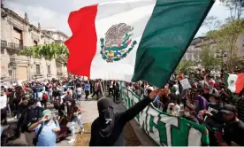  ??  ?? Hundreds of demonstrat­ors march in Guadalajar­a, Jalisco, Mexico, at the weekend in protest over the death of Giovanni López at the hands of the police. Photograph: Francisco Guasco/EPA