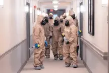  ?? JOHN BAZEMORE/ASSOCIATED PRESS ?? Members of the Georgia National Guard gather Tuesday to clean and disinfect hallways and common areas at Provident Village assisted living and memory care home in Smyrna, Ga.