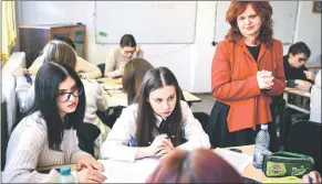  ?? ?? Obodariu (right) is pictured during lesson on the Holocaust in a school in Focsani, eastern Romania.