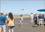  ??  ?? Hundreds of people gathered at the Colusa County Airport on Saturday to watch the dozens of planes flying in and out during the 23rd annual Colusa County Old Tyme Fly-in.