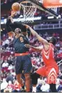  ?? AP ?? Atlanta Hawks’ Dwight Howard shoots over Houston Rockets’ James Harden during Thursday’s game.
