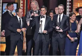  ??  ?? Ken Davenport, center, and the cast and crew of ‘Once On This Island’ accept the award for best musical revival at the 72nd annual Tony Awards at Radio City Music Hall.