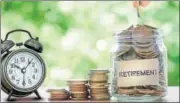  ?? GETTY IMAGES/ISTOCKPHOT­O ?? Hand putting Coins in glass jar with retro alarm clock for time to money saving for retirement concept