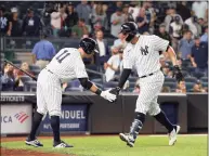  ?? Jim McIsaac / Getty Images ?? The Yankees’ Gary Sanchez, left, celebrates his second inning home run against the Rangers with teammate Brett Gardner on Monday in New York.