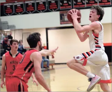  ??  ?? LaFayette junior Jon Morgan drives to the basket in the first half of the Ramblers’ state playoff game against North Oconee on Saturday night. Morgan had 21 points on the night, 16 coming in the first half. (Messenger photo/Scott Herpst)