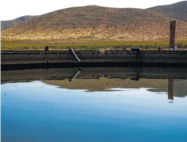  ?? Michael Ciaglo / Houston Chronicle ?? Water from a well on the Apache Ranch in Van Horn is stored in a holding tank last month.