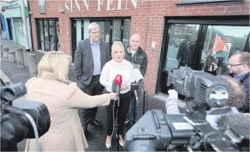  ??  ?? Sinn Fein’s Michelle O’Neill and party colleagues John O’Dowd (left) and Paul Maskey speak to the press yesterday