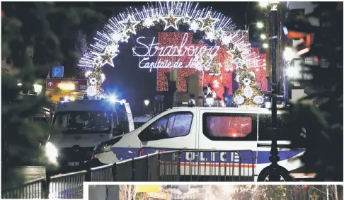  ?? — Reuters photo ?? Police secure area where a suspect is sought after a shooting in Strasbourg.