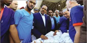  ??  ?? Somalia’s President Mohamed Abdullahi Mohamed visits a child injured in the truck bomb explosion at the Afgoye junction, and who waits to be transporte­d on a Turkish military cargo plane at the Aden Abdulle Internatio­nal Airport in Mogadishu, yesterday.