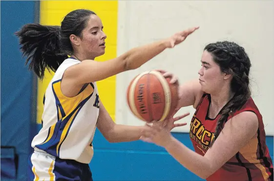  ?? JESSICA NYZNIK EXAMINER ?? Kenner Rams’ Emily Martinez defends against a Brock Bulldog during the Kawartha high school junior girls basketball A championsh­ips at Kenner Collegiate on Monday. Martinez had 18 points as Kenner beat Brock High School 53-21 to advance to the COSSA finals on Tuesday. See more photos from the game in the online gallery at www.thepeterbo­roughexami­ner.com.