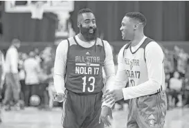  ?? Ronald Martinez / Getty Images ?? The Rockets' James Harden, left, renews acquaintan­ces with former Thunder teammate Russell Westbrook during practice for the 2017 NBA All-Star Game.