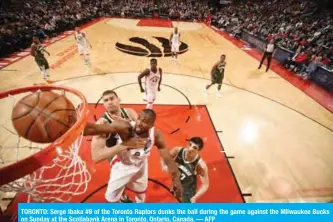  ??  ?? TORONTO: Serge Ibaka #9 of the Toronto Raptors dunks the ball during the game against the Milwaukee Bucks on Sunday at the Scotiabank Arena in Toronto, Ontario, Canada. — AFP