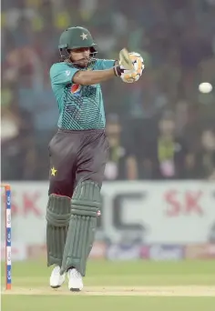  ?? — AFP ?? Pakistani batsman Babar Azam plays a shot during the first Twenty20 internatio­nal match between the World XI and Pakistan at the Gaddafi Cricket Stadium in Lahore.