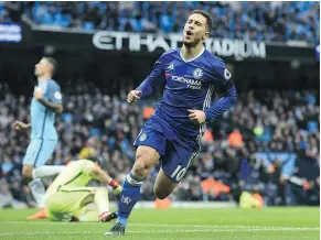  ?? — GETTY IMAGES ?? Chelsea’s Eden Hazard celebrates after scoring his team’s third goal during their English Premier League match against Manchester City in Manchester on Saturday.