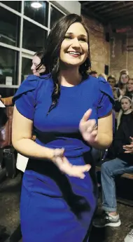  ?? EILEEN MESLAR / TELEGRAPH HERALD VIA THE ASSOCIATED PRESS ?? Abby Finkenauer celebrates after winning the election for Iowa’s 1st Congressio­nal District on Tuesday.