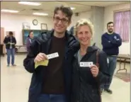  ?? EVAN BRANDT — DIGITAL FIRST MEDIA ?? Daniel Murphy, was voter number 700 at the Grace Lutheran Church polling place in Pottstown. To his right is Amy Gazillo, voter 699. During the primary election in May only 259 votes were cast there all day.