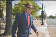  ?? The Associated Press ?? FLYNN: Michael Flynn, President Donald Trump's former national security adviser, leaves the federal court on Sept. 10, 2019, following a status conference in Washington. The arrest of President Donald Trump’s former chief strategist Steve Bannon adds to a growing list of Trump associates ensnared in legal trouble. They include the president's former campaign chair, Paul Manafort, whom Bannon replaced, his longtime lawyer, Michael Cohen, and his former national security adviser, Michael Flynn.