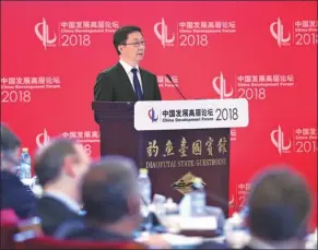  ?? PANG XINGLEI / XINHUA ?? Vice-Premier Han Zheng speaks at the China Developmen­t Forum 2018 in Beijing on Sunday. He said unilateral­ism and trade wars benefit no one.