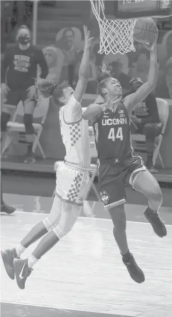  ?? RANDYSARTI­N/USATODAYSP­ORTS ?? UConn forward Aubrey Griffin (44) goes to the basket against Tennessee guard Rae Burrell (12) during the second half at Thompson-Boling Arena.