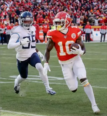  ?? Associated Press ?? Wide receiver Tyreek Hill scores one of his two touchdowns in the Chiefs’ 35-24 win.