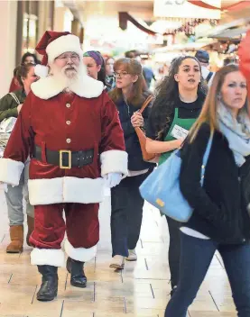  ?? BUTCH COMEGYS/AP ?? Like Santa, you, too, could work at the mall this holiday season. Many retailers are offering better wages, discounts and even prizes.